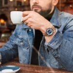 Photo of Man Sitting While Holding Cup